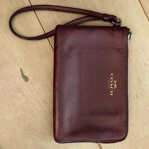 Coach of New York‎ purple wristlet.